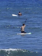 Luanapoko Beach surfers